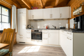 Verlockendes Ferienhaus aus Blockbohlen mit modernen Annehmlichkeiten - Küchenbereich